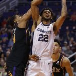 Memphis Grizzlies guard Tyler Dorsey, right, drives past Phoenix Suns guard De'Anthony Melton, left, in the first half during an NBA basketball game, Saturday, March 30, 2019, in Phoenix. (AP Photo/Rick Scuteri)