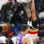 New Orleans Pelicans forward Anthony Davis (23) dunks the ball over Phoenix Suns forward Dragan Bender (35) during the first half of an NBA basketball game in New Orleans, Saturday, March 16, 2019. (AP Photo/Tyler Kaufman)