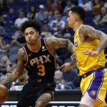 Phoenix Suns forward Kelly Oubre Jr. (3) drives on Los Angeles Lakers forward Kyle Kuzma during the second half of an NBA basketball game Saturday, March 2, 2019, in Phoenix. The Suns won 118-109.(AP Photo/Rick Scuteri)