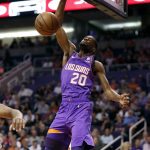Phoenix Suns forward Josh Jackson (20) dunks against the Chicago Bulls during the first half of an NBA basketball game, Monday, March 18, 2019, in Phoenix. (AP Photo/Matt York)