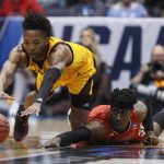 Arizona State's Kimani Lawrence, left, and St. John's Sedee Keita, right, dive for a loose ball during the first half of a First Four game of the NCAA men's college basketball tournament, Wednesday, March 20, 2019, in Dayton, Ohio. (AP Photo/John Minchillo)