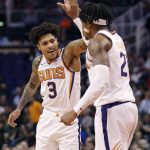 Phoenix Suns forward Kelly Oubre Jr. (3) celebrates with forward Richaun Holmes (21) during the second half of the team's NBA basketball game against the New York Knicks, Wednesday, March 6, 2019, in Phoenix. (AP Photo/Matt York)