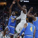 Arizona State's Luguentz Dort shoots over UCLA's Kris Wilkes (13) during the second half of an NCAA college basketball game in the quarterfinals of the Pac-12 men's tournament Thursday, March 14, 2019, in Las Vegas. (AP Photo/John Locher)