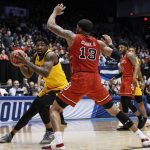 Arizona State's Romello White, left, looks to pass the ball around St. John's Marvin Clark II (13) during the first half of a First Four game of the NCAA men's college basketball tournament Wednesday, March 20, 2019, in Dayton, Ohio. (AP Photo/John Minchillo)