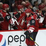 Arizona Coyotes center Alex Galchenyuk (17) celebrates his goal against the Minnesota Wild with teammates on the bench during the first period of an NHL hockey game Sunday, March 31, 2019, in Glendale, Ariz. (AP Photo/Ross D. Franklin)