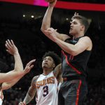 Portland Trail Blazers forward Meyers Leonard, right, shoots as Phoenix Suns forward Kelly Oubre Jr. defends during the second half of an NBA basketball game in Portland, Ore., Saturday, March 9, 2019. Portland defeated Phoenix 127-120. (AP Photo/Steve Dipaola)