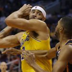 Los Angeles Lakers center JaVale McGee (7) drives against Phoenix Suns forward Mikal Bridges during the first half of an NBA basketball game Saturday, March 2, 2019, in Phoenix. (AP Photo/Rick Scuteri)