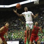 Oregon's Louis King, center, pulls down a rebound between Arizona's Chase Jeter, left, and Ira Lee during the first half of an NCAA college basketball game Saturday, March 2, 2019, in Eugene, Ore. (AP Photo/Chris Pietsch)