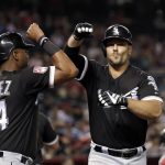 Chicago White Sox's Daniel Palka, right, is congratulated on his two-run home run by Eloy Jimenez in the seventh inning of a spring training baseball game against the Arizona Diamondbacks, Monday, March 25, 2019, in Phoenix. (AP Photo/Elaine Thompson)