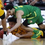 Oregon's Ehab Amin, right, and Arizona State's Taeshon Cherry scramble for the ball during the second half of an NCAA college basketball game in the semifinals of the Pac-12 men's tournament Friday, March 15, 2019, in Las Vegas. (AP Photo/John Locher)