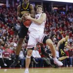 Iowa's Tyler Cook, left, and Wisconsin's Ethan Happ battle for a rebound during the second half of an NCAA college basketball game Thursday, March 7, 2019, in Madison, Wis. Wisconsin won 65-45. (AP Photo/Andy Manis)