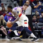 New Orleans Pelicans center Julius Randle (30) is defended by Phoenix Suns forward Dragan Bender (35) during the first half of an NBA basketball game in New Orleans, Saturday, March 16, 2019. (AP Photo/Tyler Kaufman)wld