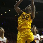 Arizona State forward De'Quon Lake (32) drives past Arizona forward Ira Lee (11) and Dylan Smith in the first half during an NCAA college basketball game, Saturday, March 9, 2019, in Tucson, Ariz. (AP Photo/Rick Scuteri)