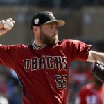 Arizona Diamondbacks relief pitcher Greg Holland throws against the Cincinnati Reds during the fourth inning of a spring baseball game in Scottsdale, Ariz., Monday, March 4, 2019. (AP Photo/Chris Carlson)