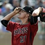 Arizona Diamondbacks starting pitcher Zack Greinke adjusts his cap after loading the bases with Cleveland Indians in the second inning of a spring training baseball game Thursday, March 7, 2019, in Scottsdale, Ariz. (AP Photo/Elaine Thompson)