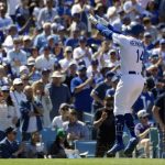 Los Angeles Dodgers' Enrique Hernandez gestures toward the crowd after hitting a two-run home run during the fourth inning of a baseball game against the Arizona Diamondbacks, Thursday, March 28, 2019, in Los Angeles. (AP Photo/Mark J. Terrill)