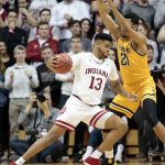 Indiana forward Juwan Morgan (13) moves to the basket under the defense of Wichita State forward Jaime Echenique (21) in the first half of an NCAA college basketball game in the third round of the NIT tournament in Bloomington, Ind., Tuesday, March 26, 2019. (AP Photo/AJ Mast)