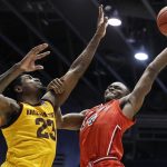 St. John's Mustapha Heron (14) shoots against Arizona State's Romello White (23) during the second half of a First Four game of the NCAA men's college basketball tournament Wednesday, March 20, 2019, in Dayton, Ohio. (AP Photo/John Minchillo)