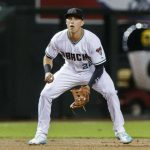 FILE - In this July 20, 2018, file photo, Arizona Diamondback' Jake Lamb plays third base against the Colorado Rockies during a baseball game in Phoenix. With key players still on the roster and new players who should fill at least some of the void, the Diamondbacks are hoping to compete for a playoff spot even with one of baseball's best players on a new team.
(AP Photo/Darryl Webb, File)