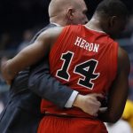 St. John's Mustapha Heron (14) hugs coach Chris Mullin, left, after fouling out during the second half against Arizona State in a First Four game of the NCAA men's college basketball tournament Wednesday, March 20, 2019, in Dayton, Ohio. (AP Photo/John Minchillo)