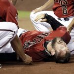 Arizona Diamondbacks' Steven Souza Jr. lies on the field after getting injured while scoring against the Chicago White Sox in the fourth inning of a spring training baseball game Monday, March 25, 2019, in Phoenix, Ariz. (AP Photo/Elaine Thompson)