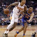Phoenix Suns forward Kelly Oubre Jr. (3) drives past New York Knicks guard Allonzo Trier (14) during the second half of an NBA basketball game Wednesday, March 6, 2019, in Phoenix. (AP Photo/Matt York)