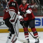 Arizona Coyotes defenseman Oliver Ekman-Larsson celebrates with Darcy Kuemper (35) after scoring a short handed goal against the Anaheim Ducks in the first period during an NHL hockey game, Thursday, March 14, 2019, in Glendale, Ariz. (AP Photo/Rick Scuteri)