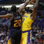 Los Angeles Lakers forward LeBron James (23) drives past Phoenix Suns forward Josh Jackson during the first half of an NBA basketball game Saturday, March 2, 2019, in Phoenix. (AP Photo/Rick Scuteri)