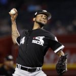 Chicago White Sox starting pitcher Ervin Santana throws to an Arizona Diamondbacks batter during the first inning of a spring training baseball game Monday, March 25, 2019, in Phoenix. (AP Photo/Elaine Thompson)