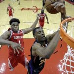 Phoenix Suns' Josh Jackson, right, is fouled by Houston Rockets' Danuel House Jr. (4) during the second half of an NBA basketball game Friday, March 15, 2019, in Houston. The Rockets won 108-102. (AP Photo/David J. Phillip)