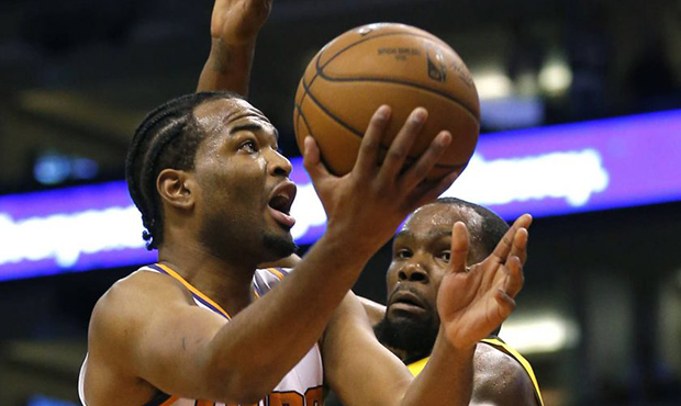 Phoenix Suns forward T.J. Warren (12) drives by Golden State Warriors forward Kevin Durant during t...