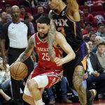 Houston Rockets' Austin Rivers (25) is fouled by Phoenix Suns' Kelly Oubre Jr. (3) during the second half of an NBA basketball game Friday, March 15, 2019, in Houston. The Rockets won 108-102. (AP Photo/David J. Phillip)