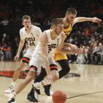 Oregon State's Tres Tinkle (3) tries to outrun Arizona State's Vitaliy Shibel (10) during the first half of an NCAA college basketball game in Corvallis, Ore., Sunday, March 3, 2019. (AP Photo/Amanda Loman)
