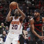 Phoenix Suns forward Josh Jackson, left, shoots as Portland Trail Blazers forward Maurice Harkless, right, defends during the first half of an NBA basketball game in Portland, Ore., Saturday, March 9, 2019. (AP Photo/Steve Dipaola)