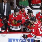 Chicago Blackhawks center Jonathan Toews (19) celebrates with teammates after his penalty goal against the Arizona Coyotes during the second period of an NHL hockey game Monday, March 11, 2019, in Chicago. (AP Photo/Kamil Krzaczynski)