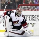 A shootout shot by New Jersey Devils center Pavel Zacha, not visible, of the Czech Republic, gets by Arizona Coyotes goaltender Darcy Kuemper (35) for a goal during an NHL hockey game, Saturday, March 23, 2019, in Newark, N.J. The Devils won 2-1 in a shootout. (AP Photo/Julio Cortez)