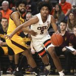 Oregon State's Ethan Thompson (5) slips past Arizona State's Remy Martin (1) during the first half of an NCAA college basketball game in Corvallis, Ore., Sunday, March 3, 2019. (AP Photo/Amanda Loman)