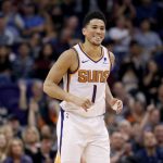 Phoenix Suns guard Devin Booker smiles after making a 3-pointer against the New York Knicks during the second half of an NBA basketball game Wednesday, March 6, 2019, in Phoenix. (AP Photo/Matt York)