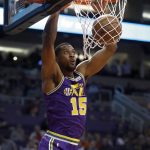 Utah Jazz forward Derrick Favors dunks against the Phoenix Suns during the first half of an NBA basketball game Wednesday, March 13, 2019, in Phoenix. (AP Photo/Matt York)