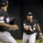 Chicago White Sox first baseman Jose Abreu, right, tosses the ball to starting pitcher Ervin Santana, left, after fielding a ground ball from Arizona Diamondbacks' Luke Weaver in the third inning of a spring training baseball game Monday, March 25, 2019, in Phoenix, Ariz. Weaver was out on the play. (AP Photo/Elaine Thompson)