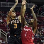 Phoenix Suns' Kelly Oubre Jr. (3) shoots as Houston Rockets' Iman Shumpert (1) defends during the first half of an NBA basketball game Friday, March 15, 2019, in Houston. (AP Photo/David J. Phillip)