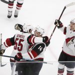 Arizona Coyotes right wing Richard Panik (14) celebrates with defenseman Jason Demers (55) after scoring against the Chicago Blackhawks during the first period of an NHL hockey game Monday, March 11, 2019, in Chicago. (AP Photo/Kamil Krzaczynski)