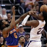 New York Knicks center DeAndre Jordan (6) blocks the shot of Phoenix Suns center Deandre Ayton (22) during the first half of an NBA basketball game Wednesday, March 6, 2019, in Phoenix. (AP Photo/Matt York)