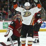 Anaheim Ducks center Adam Henrique, front, celebrates his goal against Arizona Coyotes goaltender Darcy Kuemper (35) during the third period of an NHL hockey game Tuesday, March 5, 2019, in Glendale, Ariz. The Ducks won 3-1. (AP Photo/Ross D. Franklin)
