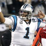 Carolina Panthers' Cam Newton (1) signals after making a first down against the Arizona Cardinals in the first half of an NFL wild card playoff football game in Charlotte, N.C., Saturday, Jan. 3, 2015. (AP Photo/Bob Leverone)