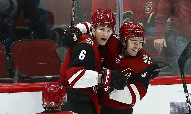 Arizona Coyotes defenseman Jakob Chychrun (6) celebrates his goal against the Calgary Flames with d...