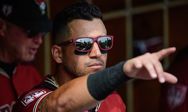 David Peralta #6 of the Arizona Diamondbacks points in the dugout during the spring training game a...