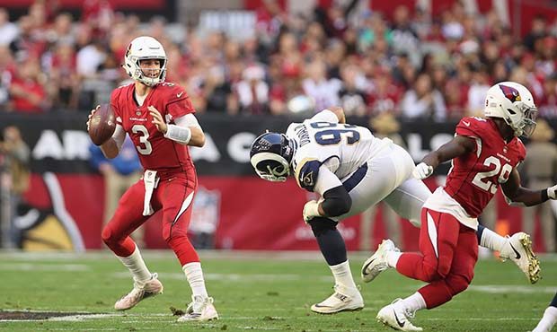Quarterback Josh Rosen #3 of the Arizona Cardinals drops back to pass during the NFL game against t...