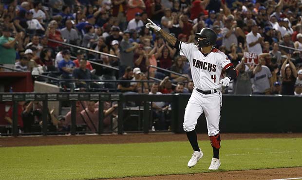 Arizona Diamondbacks' Ketel Marte points to the crowd as he rounds the bases after hitting a home r...