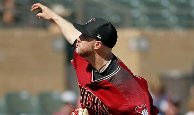Arizona Diamondbacks pitcher Merrill Kelly throws against the Cleveland Indians during the first in...